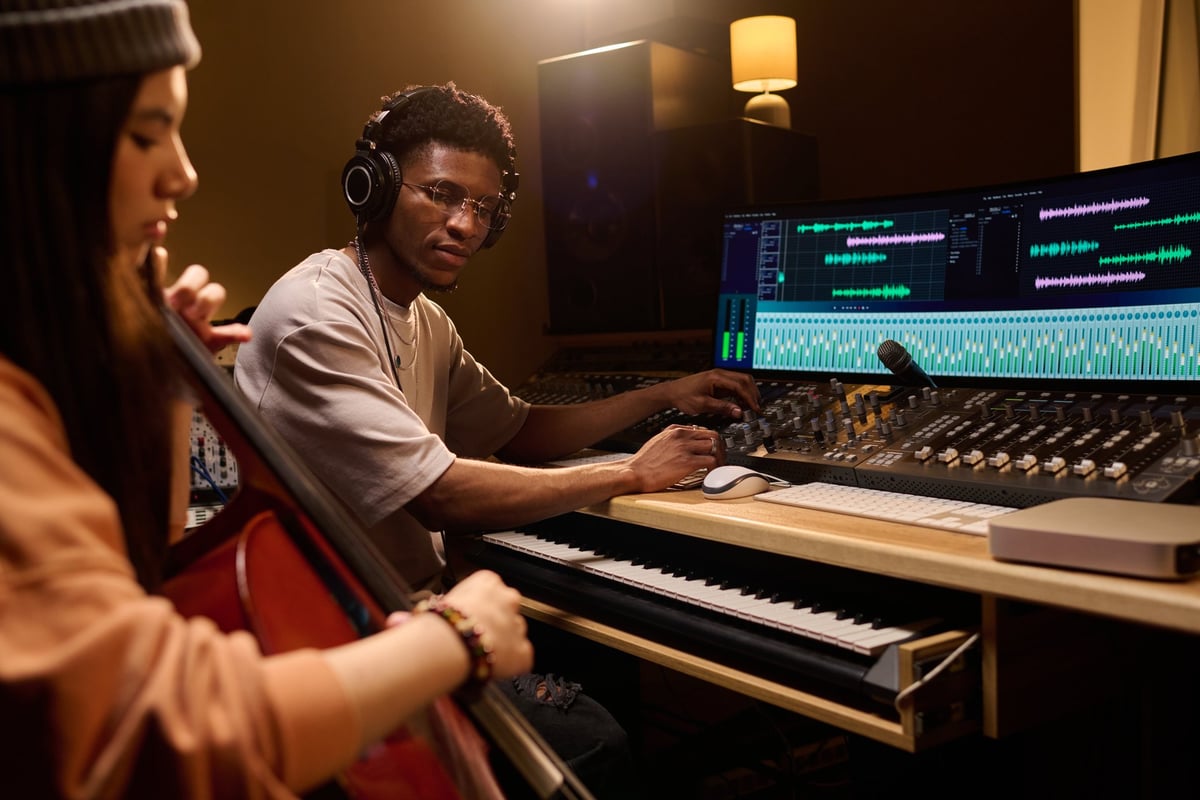 Producer and cellist recording an acoustic session in the studio