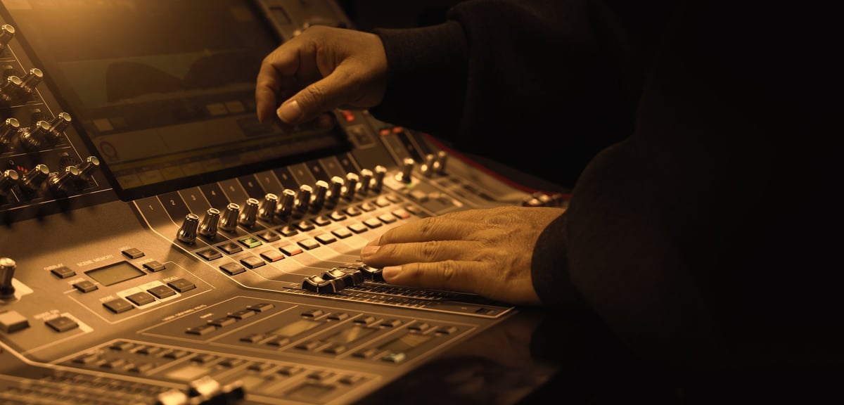 Sound engineers at a digital mixing console